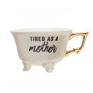 White Stoneware Footed Teacup "Tired as a Mother"