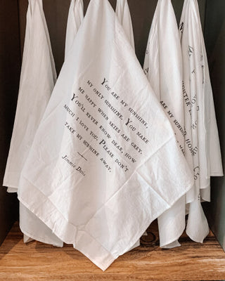 a group of white towels with black text