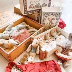 A box filled with stuffed animals and various items.