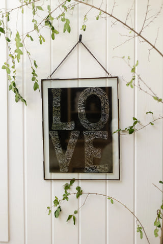  L-O-V-E Art Poster hanging on a wall