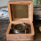 A Man Sees Tripod Compass in Wooden Box