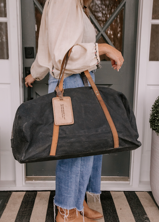 A stylish weekender duffel bag, perfect for short trips or weekend getaways.