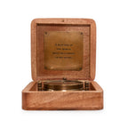 A Man Sees Tripod Compass in Wooden Box