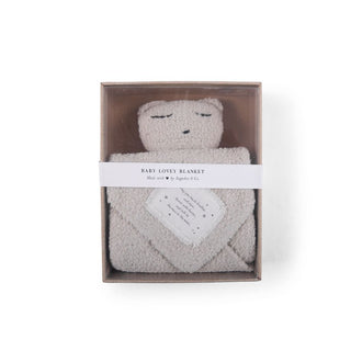 a white Bear Baby Lovey Blanket in a box