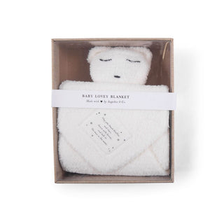 a white Bear Baby Lovey Blanket in a box