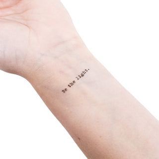 sample of the "be the light" tattoo to show size comparison on a wrist