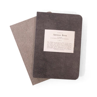 light grey artisan journal under charcoal artisan journal