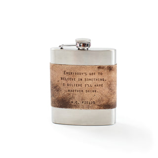 flask with the quote "everybody's got to believe in something. I believe i'll have another drink. - w.c. fields"