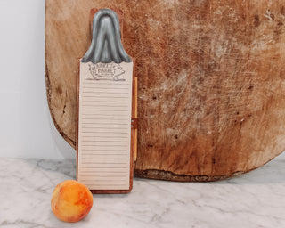 wooden clipboard with a metal clip on slot for writing utensil