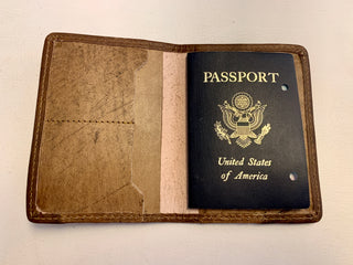 inside of leather passport to show the size of the cover in comparison to an actual passport