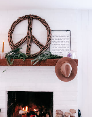 driftwood peace sign on wall