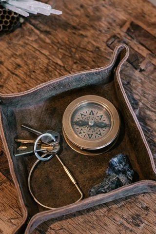Distressed Brown Leather Catchall holding compass and keys