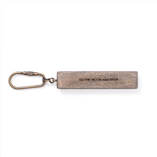 wood keychain with the quote "to the moon and back"