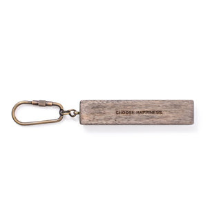 wood keychain with the quote "choose happiness"